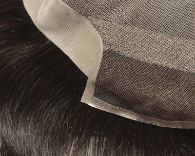 close up of a hairpiece with lace material showcasing natural hair fibers designed for hair extension and styling options